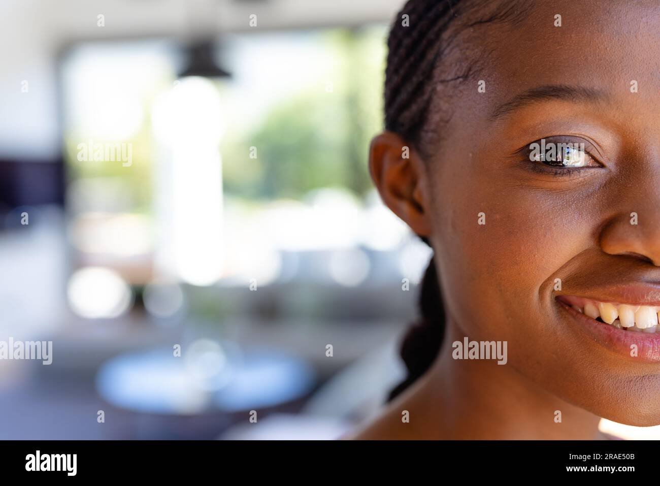 Portrait of happy african american woman looking at camera and smiling ...