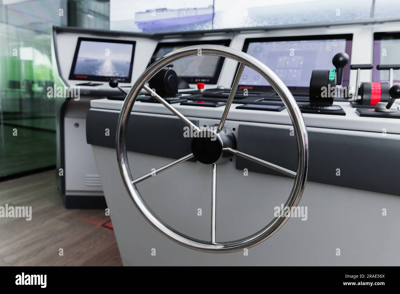 Marine navigation simulation system, ship control panel with steering wheel and electronic  equipment on the captain bridge Stock Photo