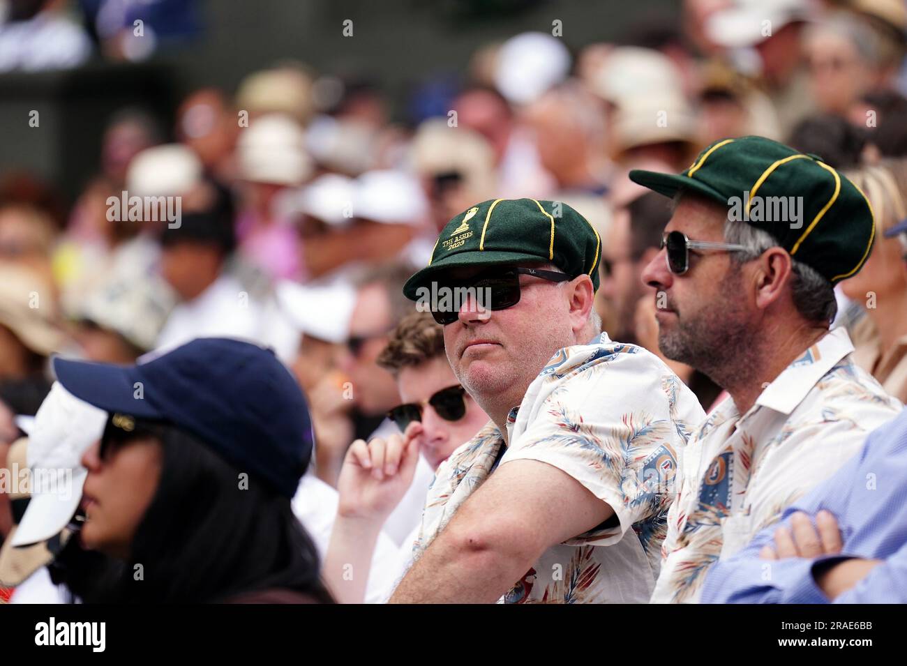 Spectators wearing Australia cricket baggy green caps on day one of the