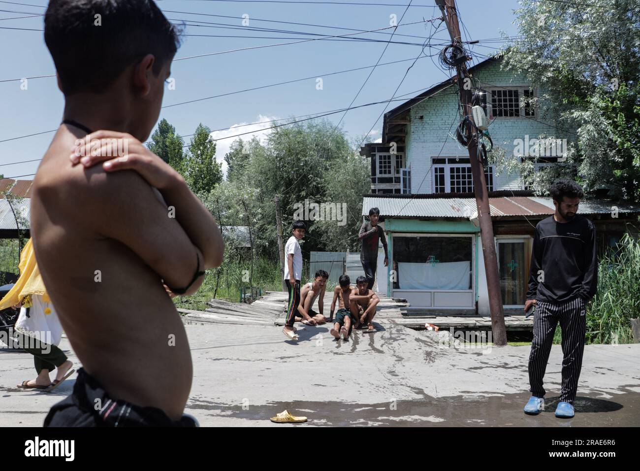 Sweltering Condition July 3, 2023, Srinagar, Jammu and Kashmir, India: Children take a bath ...