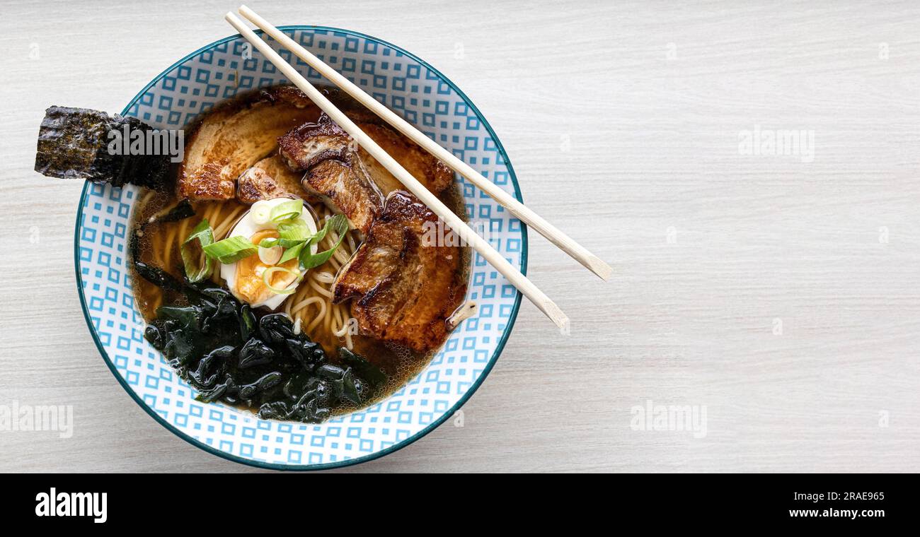 Asian Miso Ramen noodle soup with slices of chashu smoked pork, nori