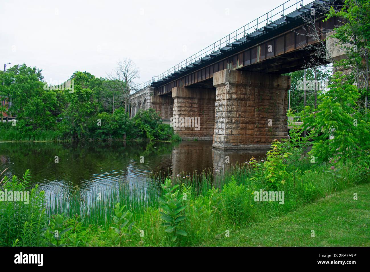 Railroad bridge supported by beautiful stone pillars, crossing the