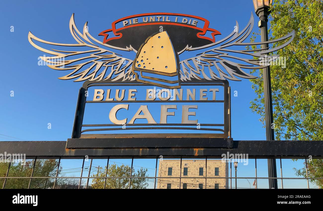 MARBLE FALLS, TX – 30 MAR 2023: Metal sign in the parking lot of the Blue Bonnet Cafe, a popular dining establishment or restaurant in Texas. Includes Stock Photo