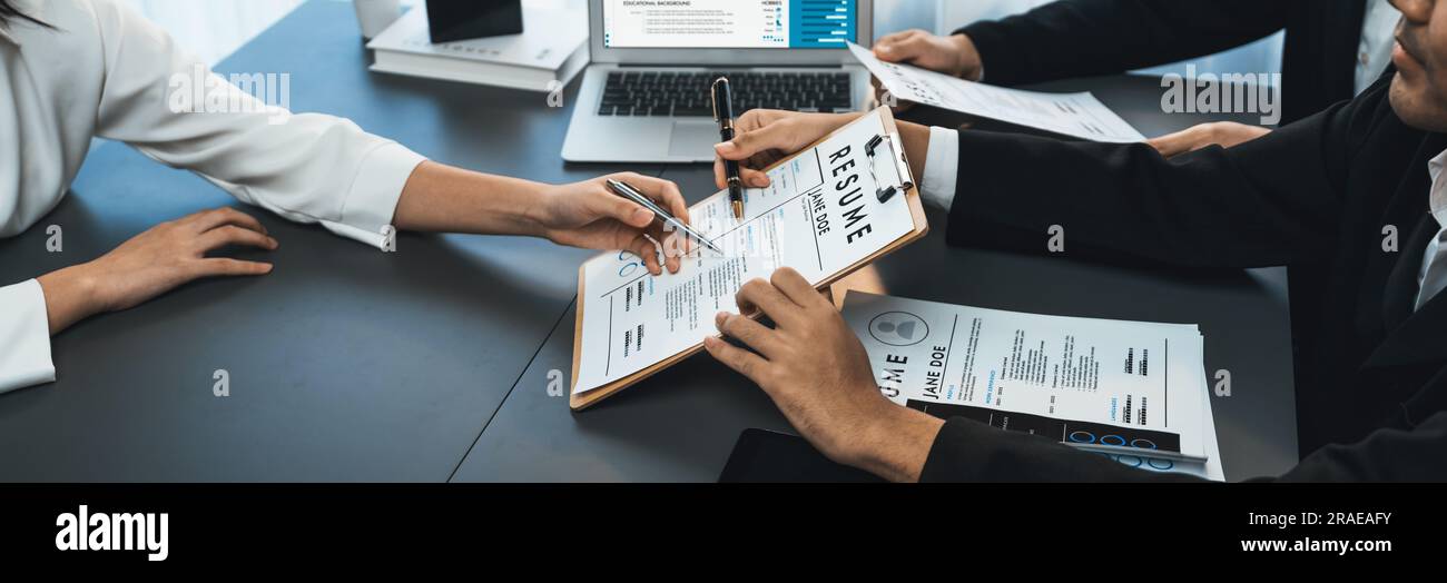 Candidate and interviewers discuss work experience and qualifications