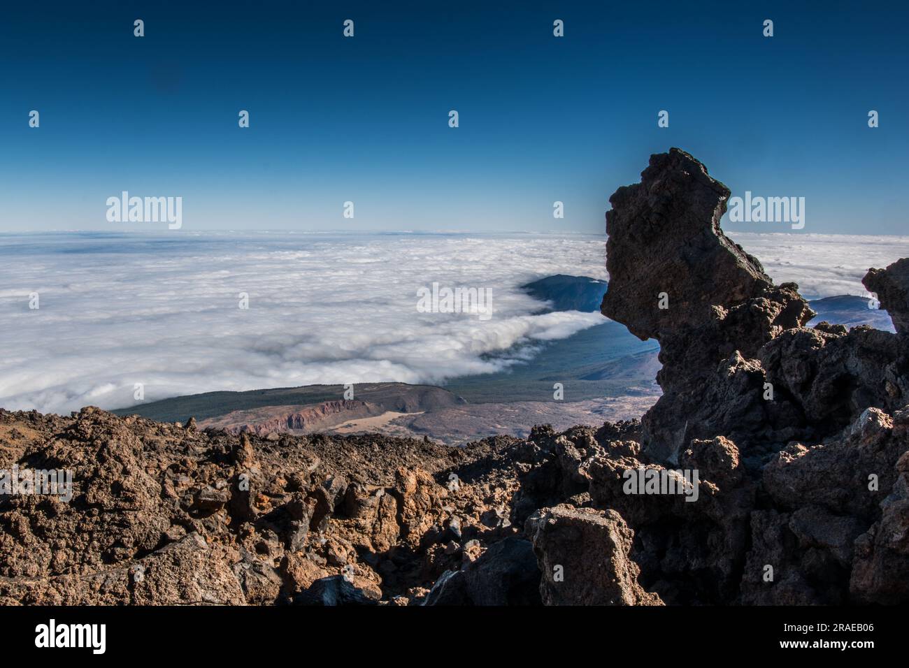 Beautiful aerial view of volcano caldera from summit Pico del Teide mountain. Lava rocks and volcanic Mars landscape in El Teide National park. Main l Stock Photo