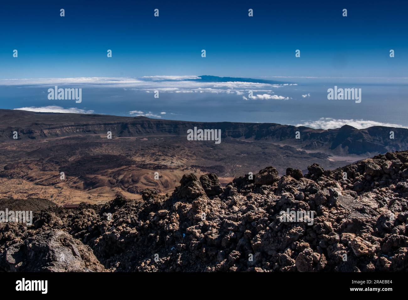 Beautiful aerial view of volcano caldera from summit Pico del Teide mountain. Lava rocks and volcanic Mars landscape in El Teide National park. Main l Stock Photo