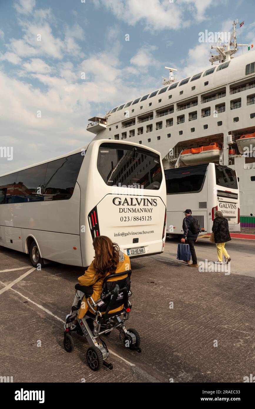 Cobh, Ireland, EU. 9 June 2023.  Cruise passengers exiting a excursion coach and returning to their cruise ship alongside in Cobh Harbour, Ireland. Stock Photo