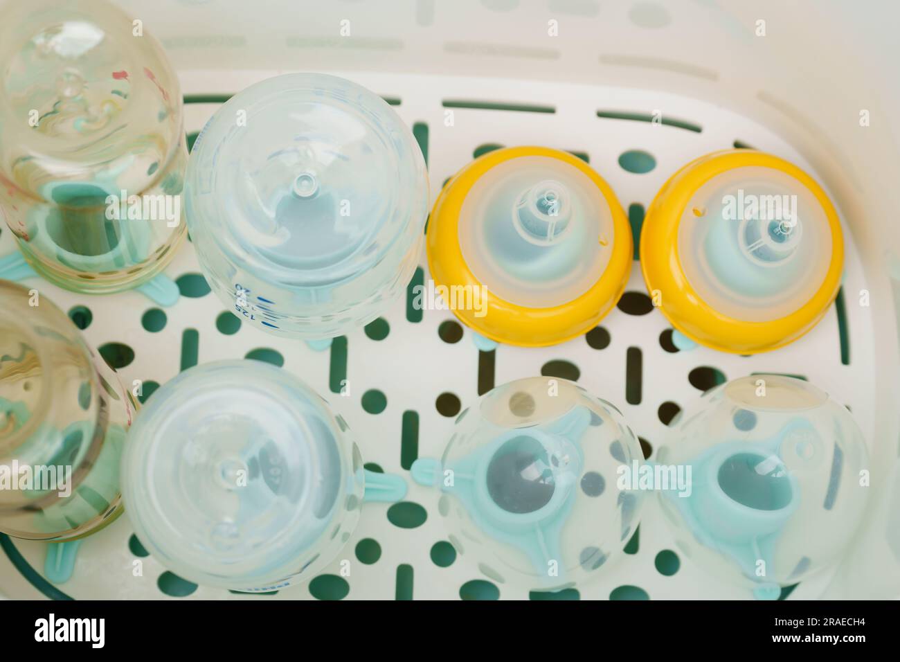 plastic baby milk bottle in the Steam sterilizer Stock Photo Alamy