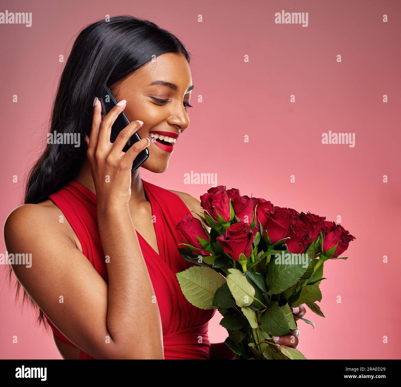 Phone call, talking and a woman with roses on a studio background for ...