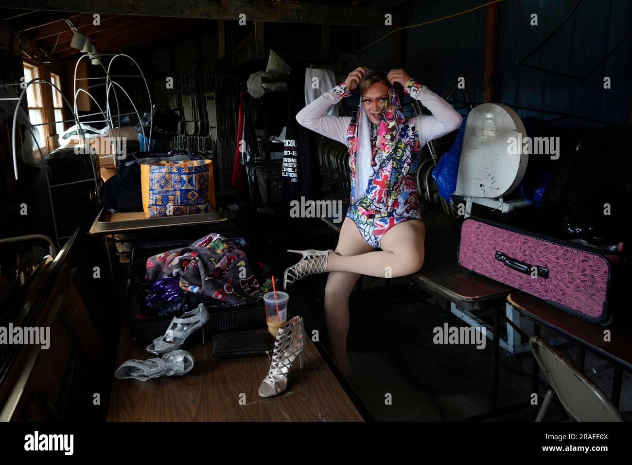 Drag queen Trixy Valentine, aka Jacob Kelley, dresses in a side storage