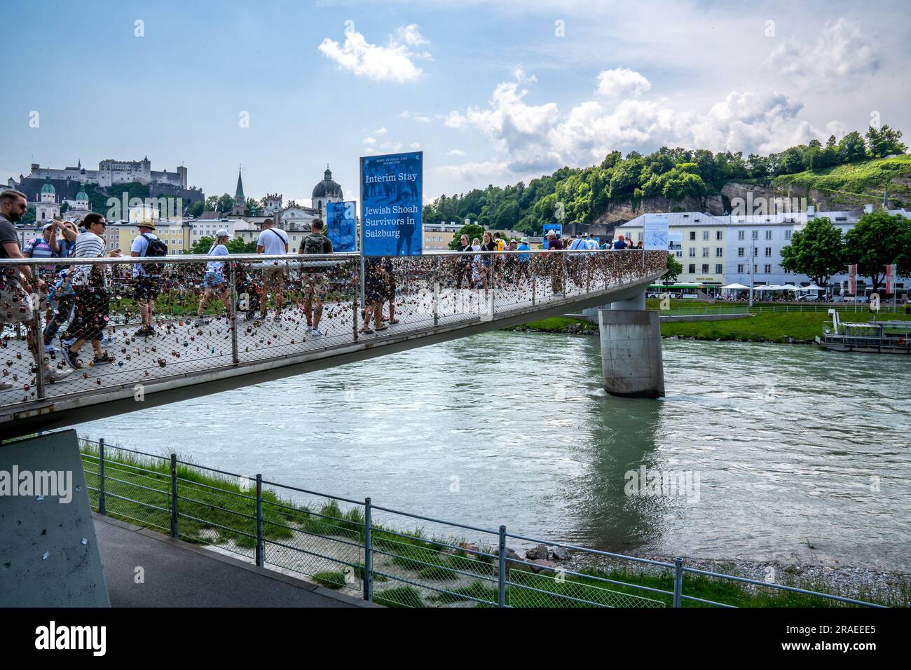 Salzburg, AT June 7, 2023 View of tourists crossing the padlock
