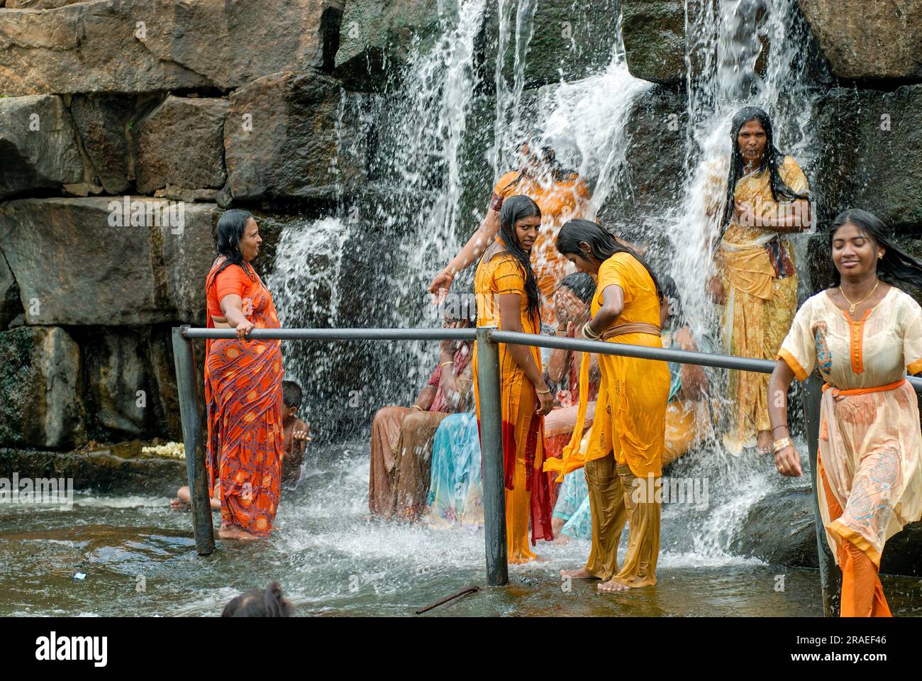 Tourists enjoying the Kodiveri waterfalls near Sathyamangalam, Tamil ...