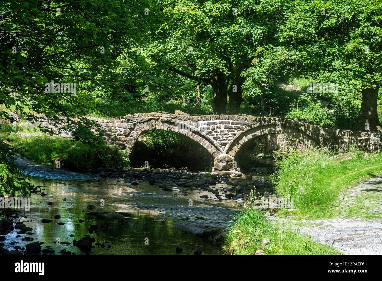 This two arched structure spans Wycoller Beck, Lancashire. Stock Photo