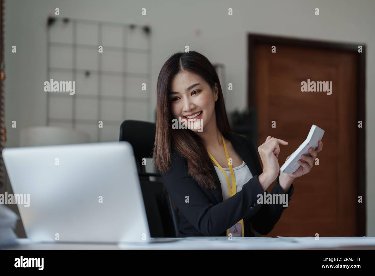 businesswoman or accountant working on calculator and laptop computer ...