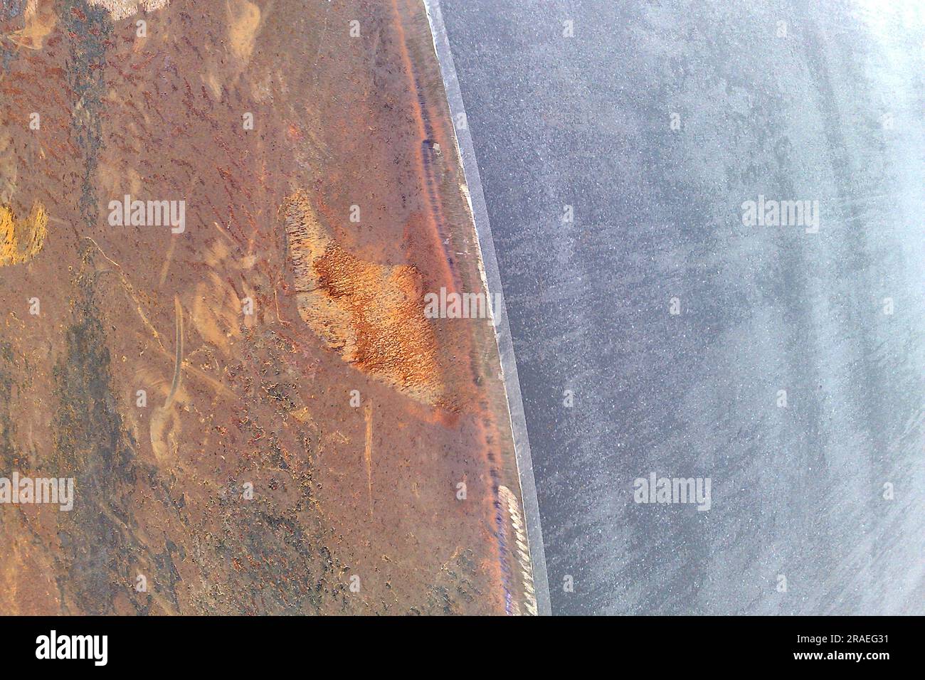 Closeup of metal construction surface before and after the