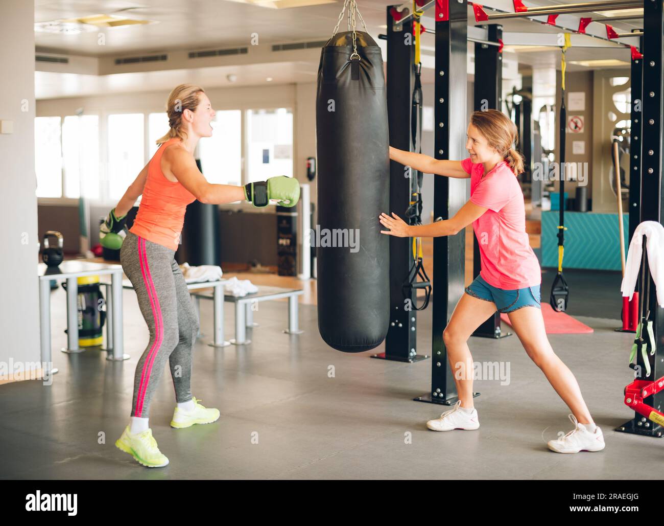 Young stressed woman boxing in fitness class Stock Photo