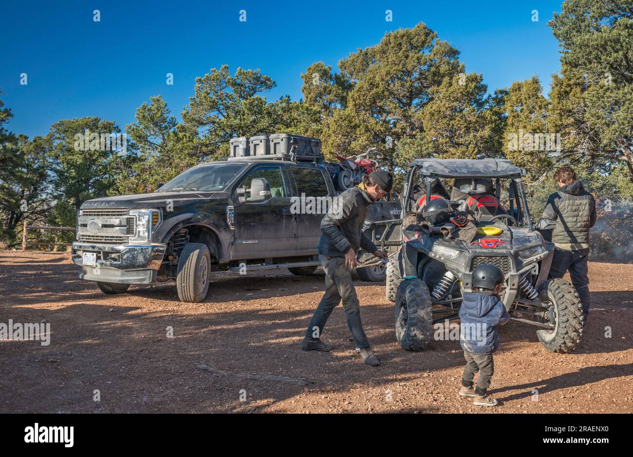 Young adults, child, UTV recreational vehicles, setting up to get going, Crazy Jug Viewpoint area, North Rim of Grand Canyon, Kaibab Plateau, Kaibab National Forest, Arizona, USA Stock Photo
