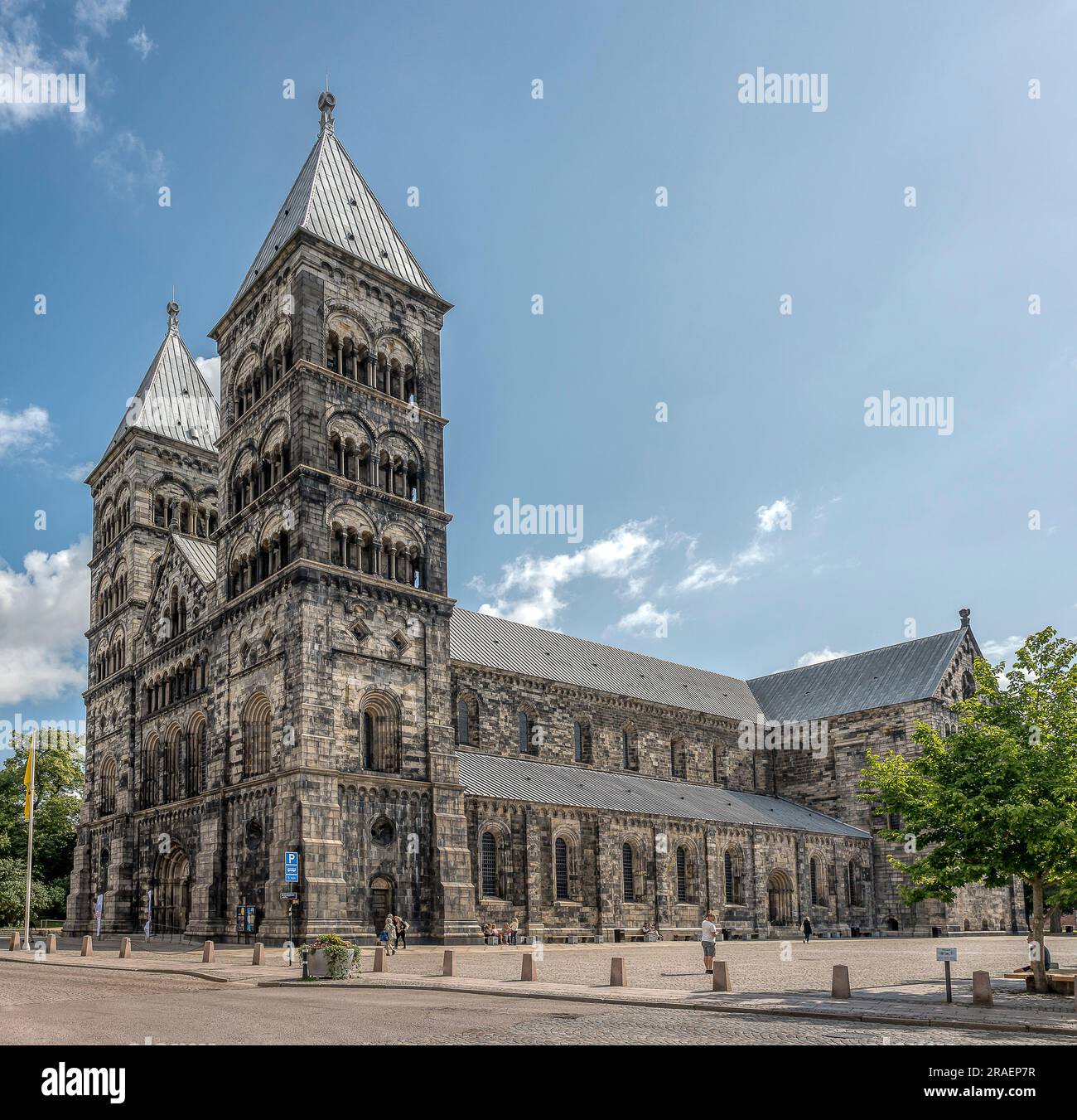 Lund Cathedral a bright summer day and some people in the sunshine, Lund, Sweden, July 2, 2023 Stock Photo