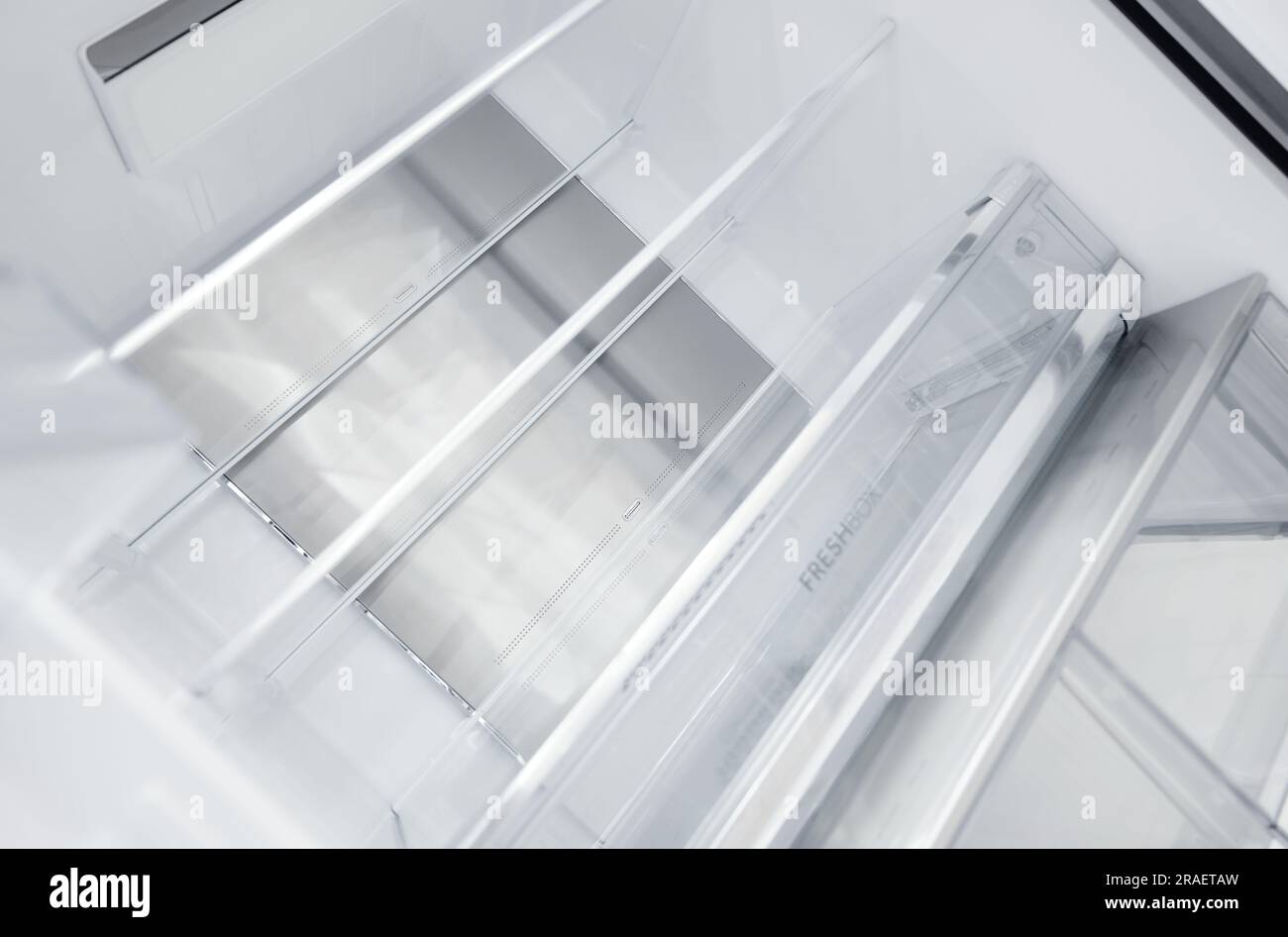 An empty refrigerator. Inside an empty, clean refrigerator, a