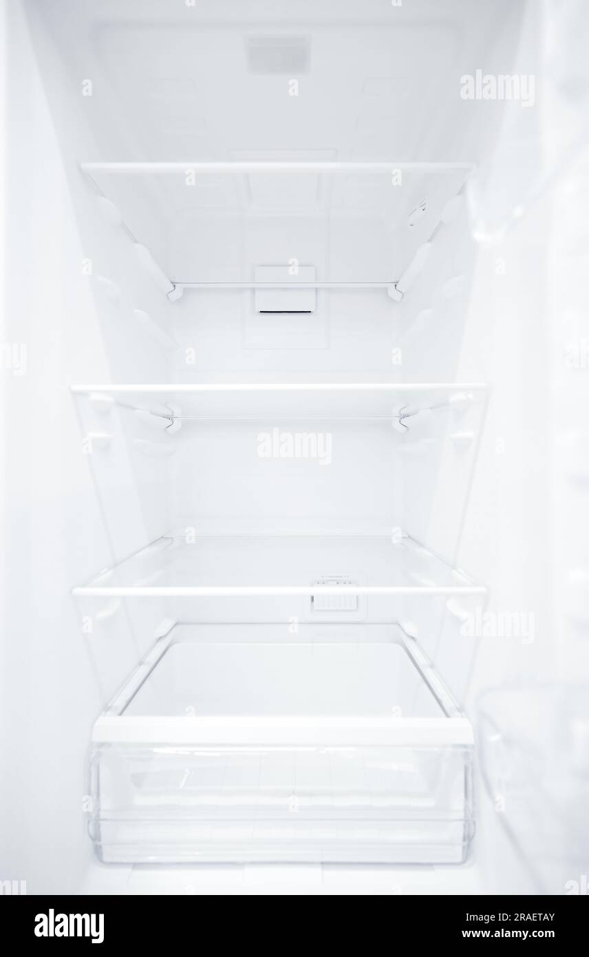 An empty refrigerator. Inside an empty, clean refrigerator, a