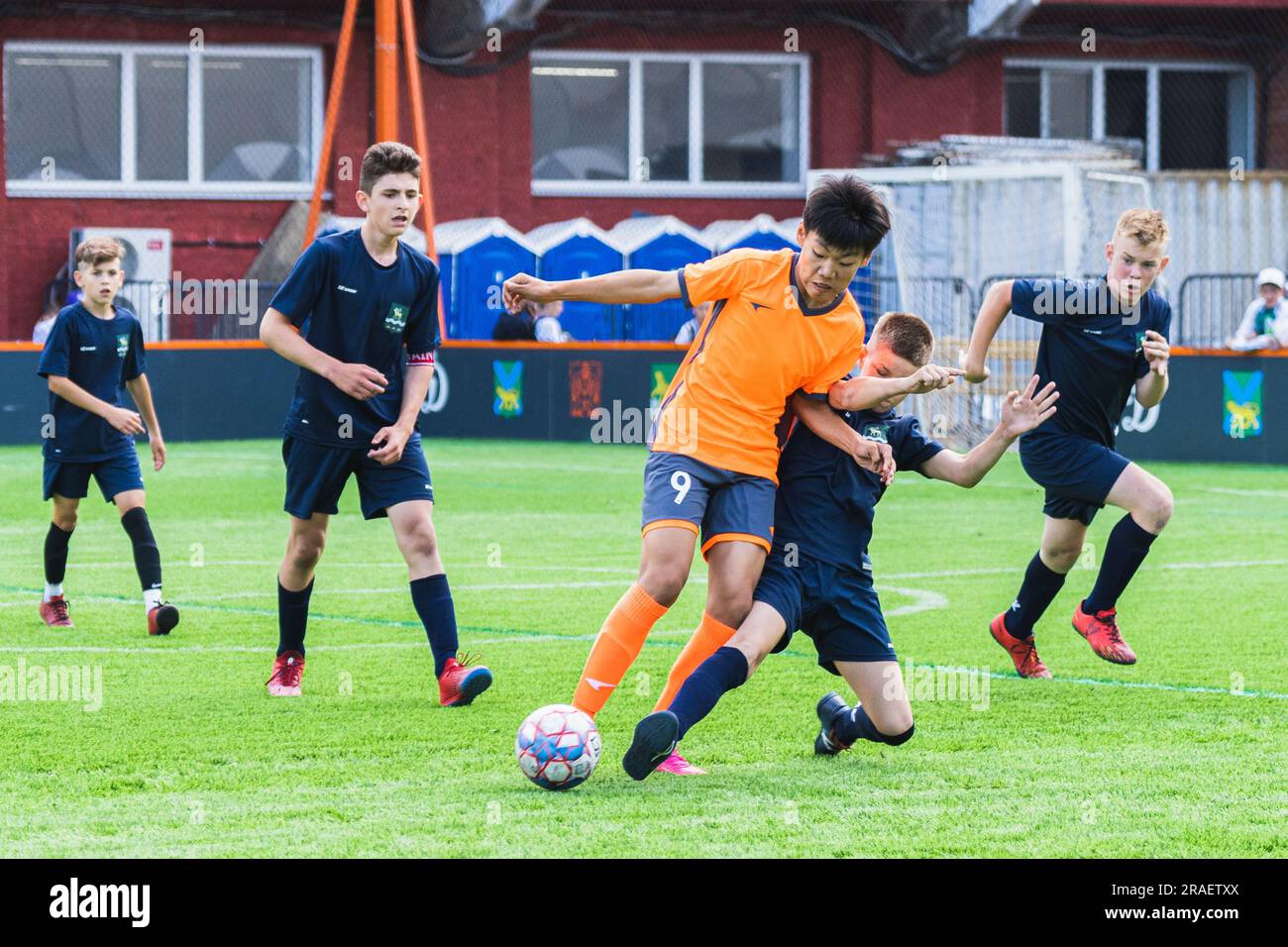 Vladivostok, Russia. 3rd July, 2023. Qiao Guanyu (front L) of Hunchun Youth Team of China competes during the men's five-a-side football match between Hunchun Youth Team of China and Yakovlevsky District Team of Russia at the Children of Primorye International Sports Games in Vladivostok, Russia, July 3, 2023. Credit: Guo Feizhou/Xinhua/Alamy Live News Stock Photo
