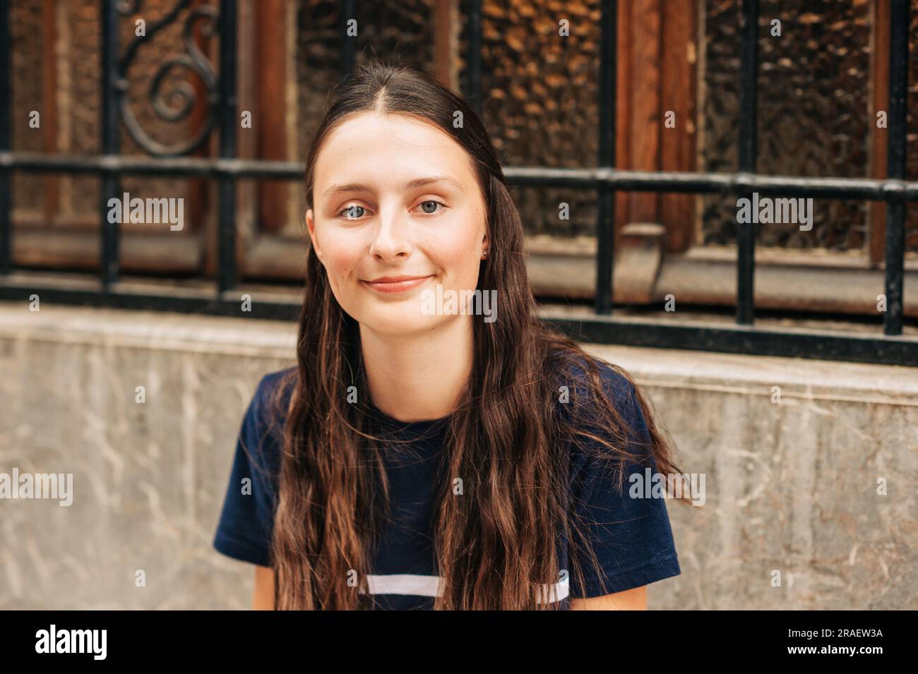 Outdoor close up portrait of pretty teenage girl on the city street ...