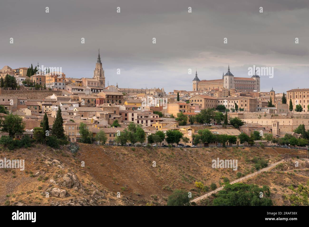 Central Spain city, view in dramatic light of the scenic old city of Toledo sited on a hill above the plains of central Spain. Stock Photo