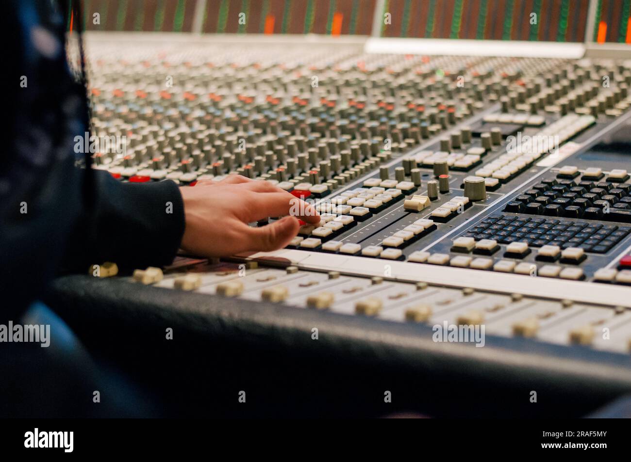 Producer working on the console in a recording studio Stock Photo