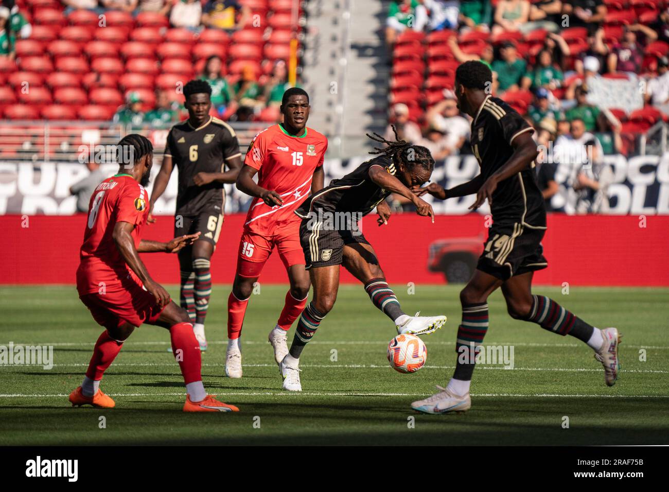 Jamaica midfielder Daniel Johnson (8) sends a pass to forward Dujuan