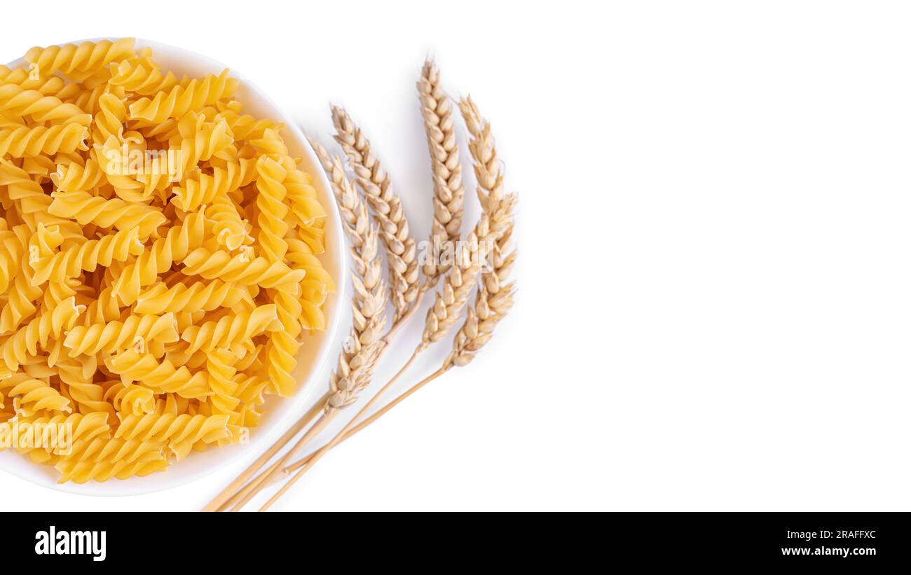 Pasta and wheat spikelets isolated on white background, banner, header ...