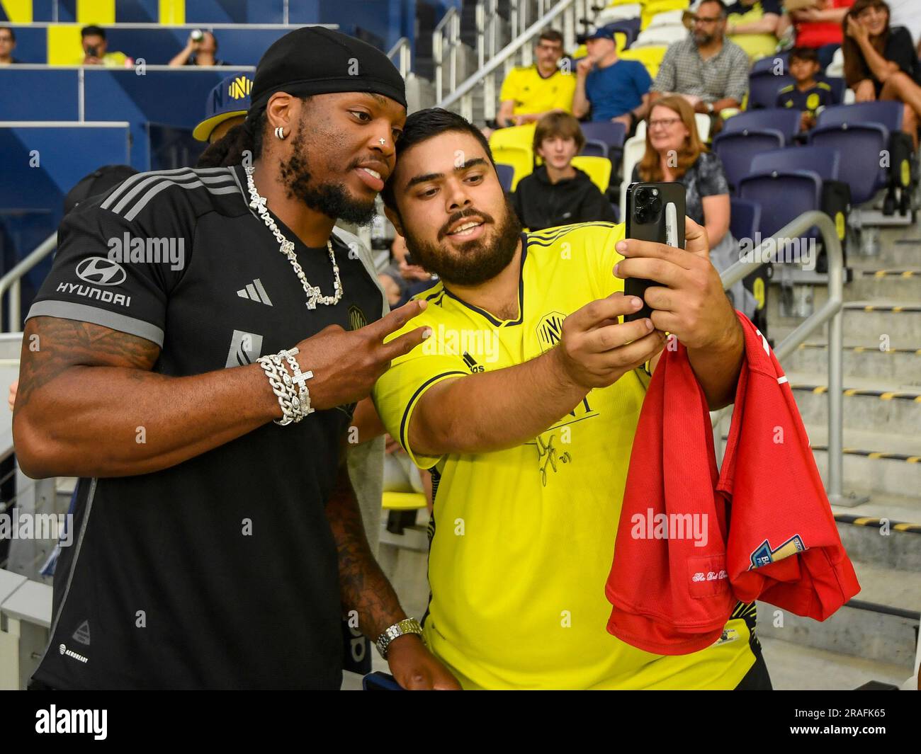 July 1, 2023: Nashville SC minority owner Tennessee Titans Derrick Henry poses with fans during the pre-game session of an MLS game between D.C. United and Nashville SC at Geodis Park in Nashville TN Steve Roberts/CSM (Credit Image: © Steve Roberts/Cal Sport Media) Stock Photo