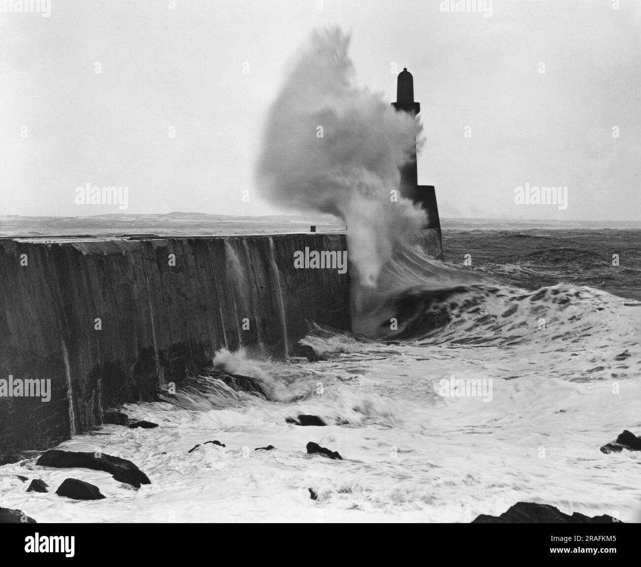 'Breaking Wave' - Pub. by George Washington Wilson (G.W.W.) - Lighthouse in Aberdeen, Scotland - Image from an antique glass lantern slide Stock Photo