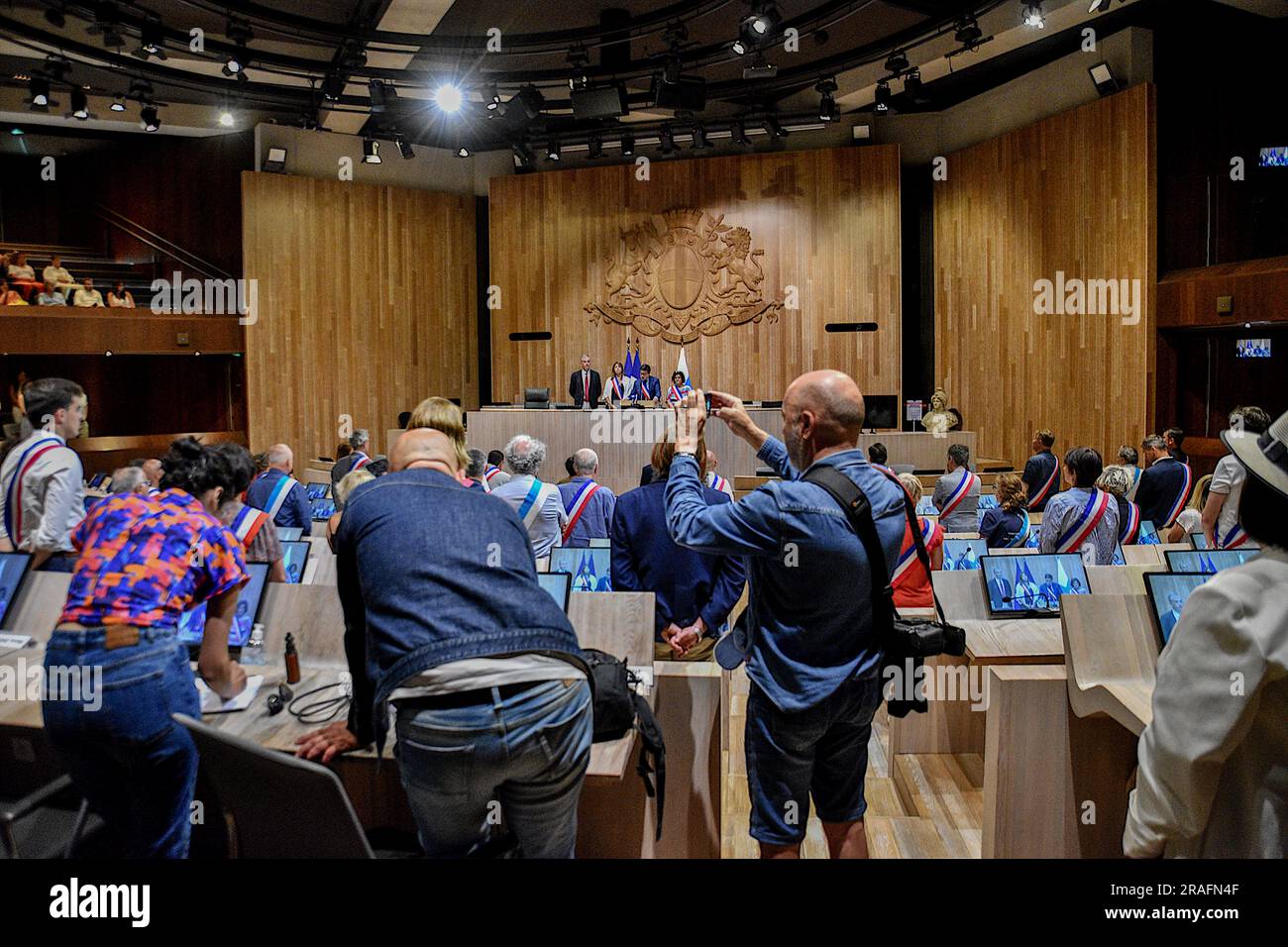 The mayor of Marseille Benoit Payan (C) speaks in the hemicycle of the