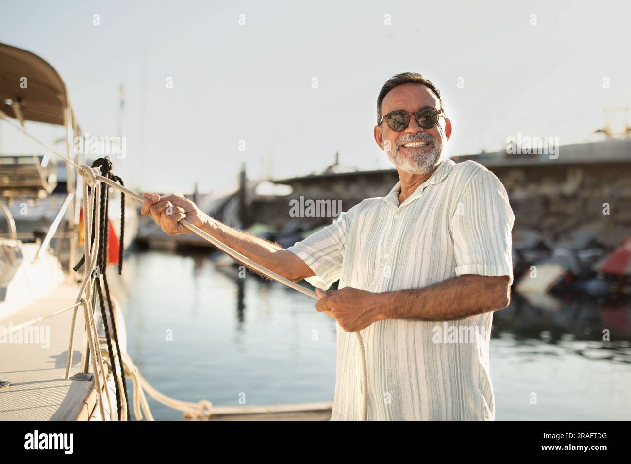 Elderly man pulling hi-res stock photography and images - Alamy