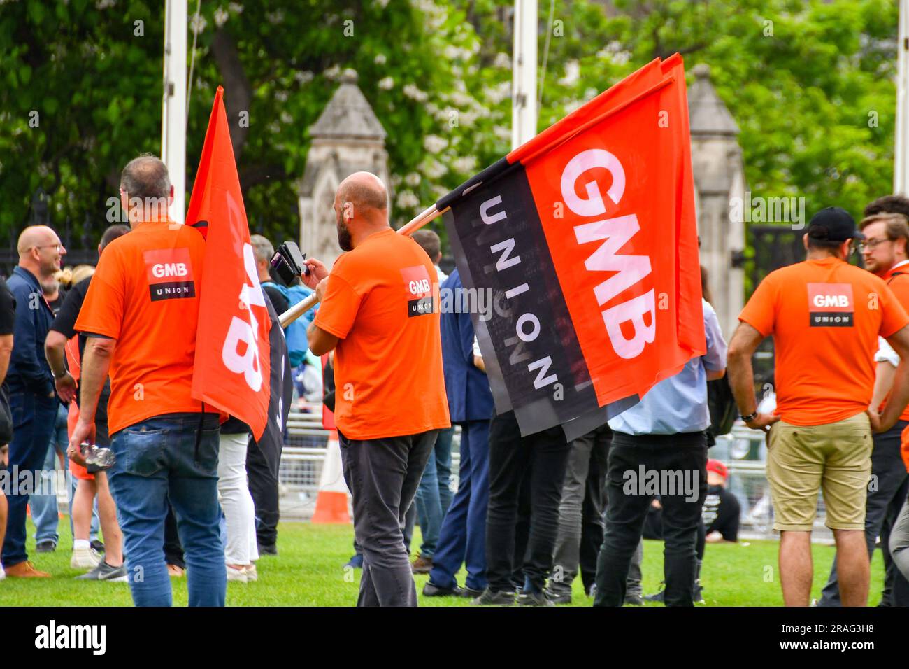 London, England, UK - 28 June 2023: People wearing t-shirts and holding flags with the logo of the GMB trade union Stock Photo