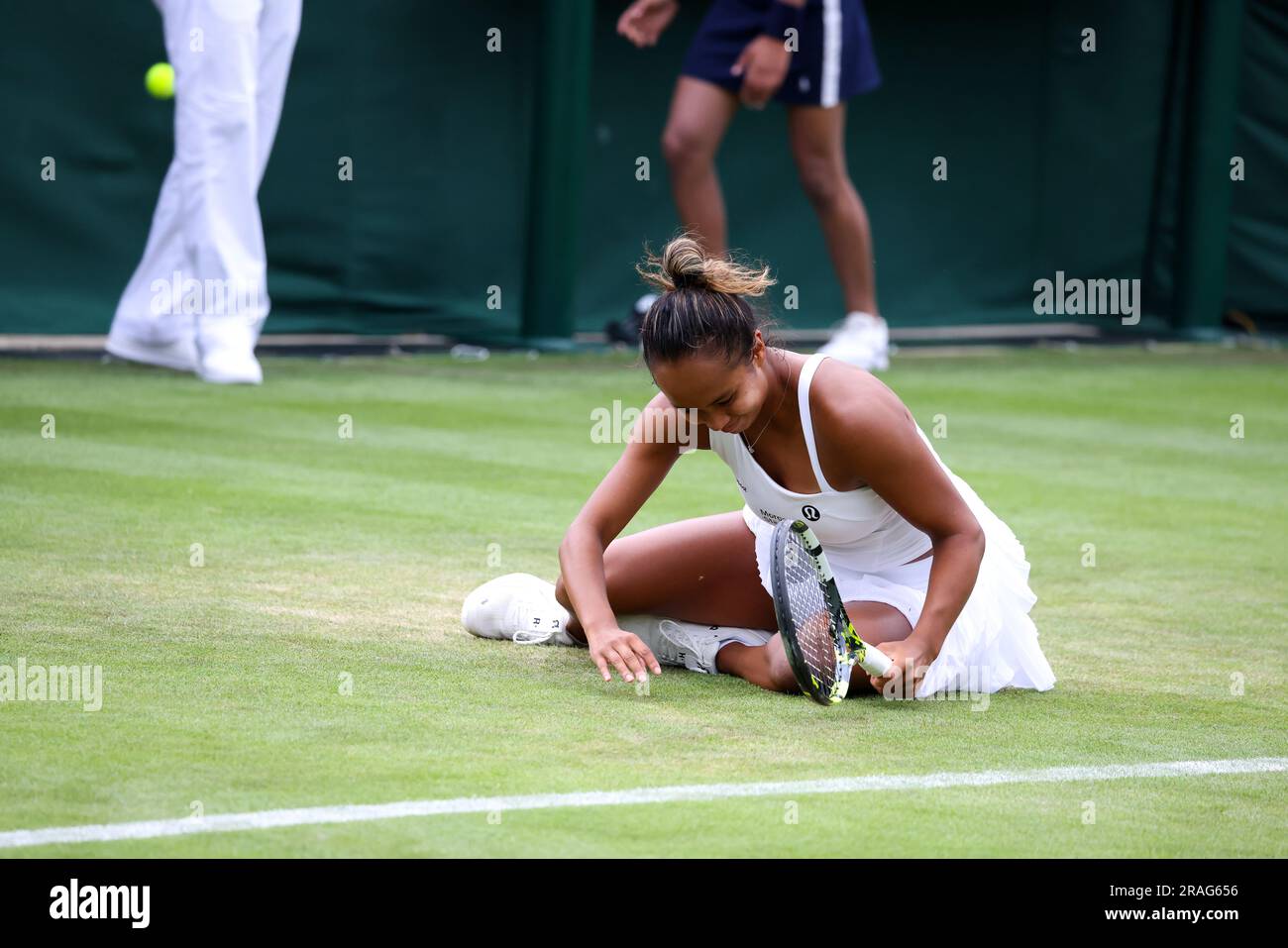 Wimbledon. Canada's Leylah Fernandez takes a tumble during her first round match against Katerina Baindl of, Ukraine. 03rd July, 2023. during opening day at Wimbledon. Credit: Adam Stoltman/Alamy Live News Stock Photo