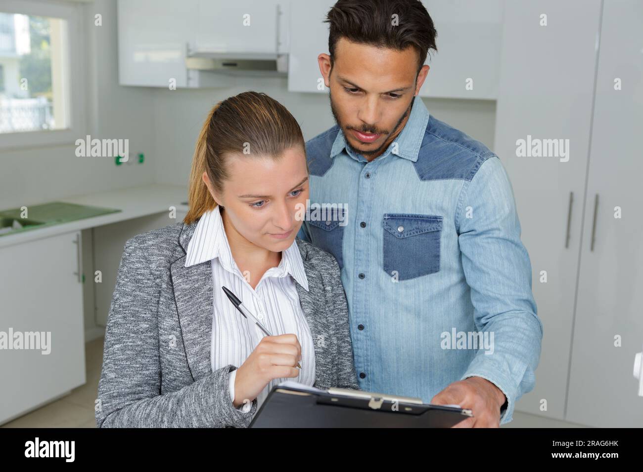 businessman showing real estate concept on a clipboard Stock Photo