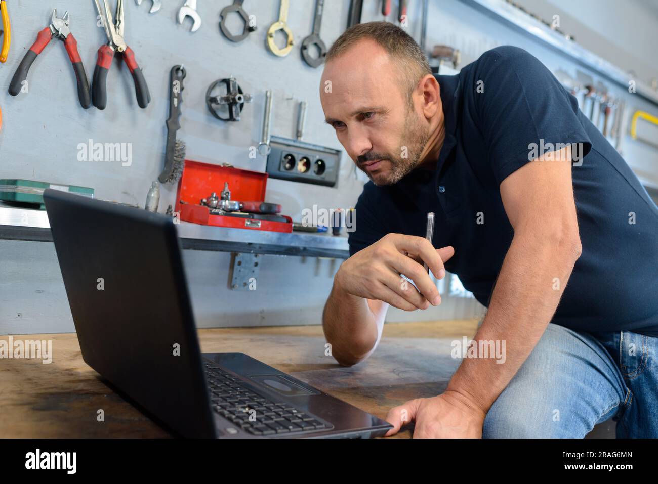 Man Looking Computer Woodworker looking design hi-res stock photography and images - Alamy