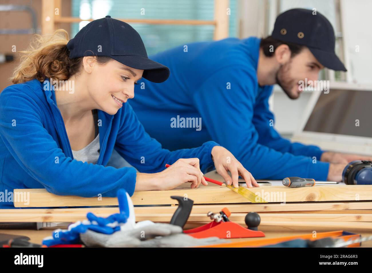 Woman man teamwork carpentry shop hi-res stock photography and images ...