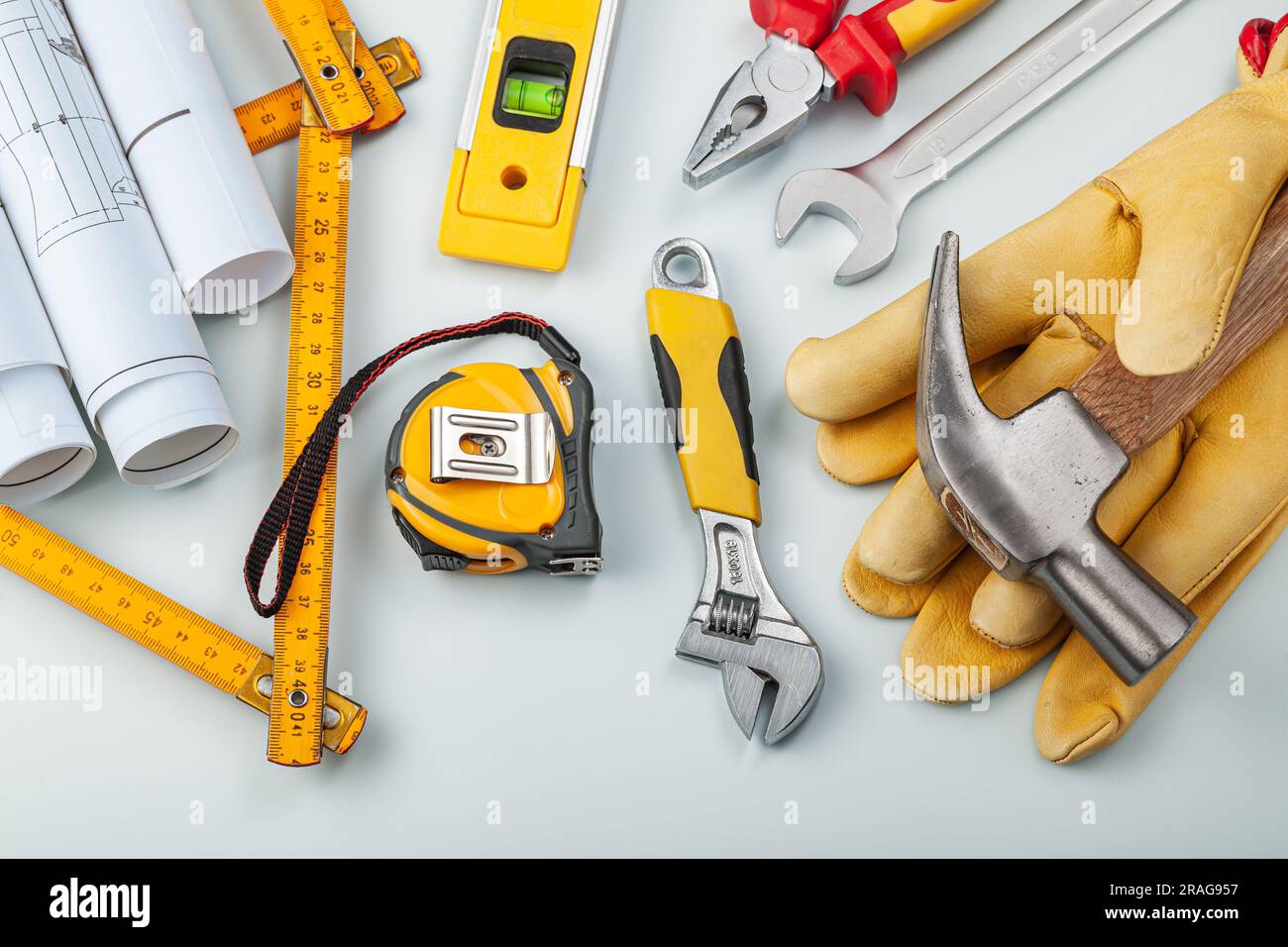 Blueprints Gloves And Construction Tools On White Background Stock ...