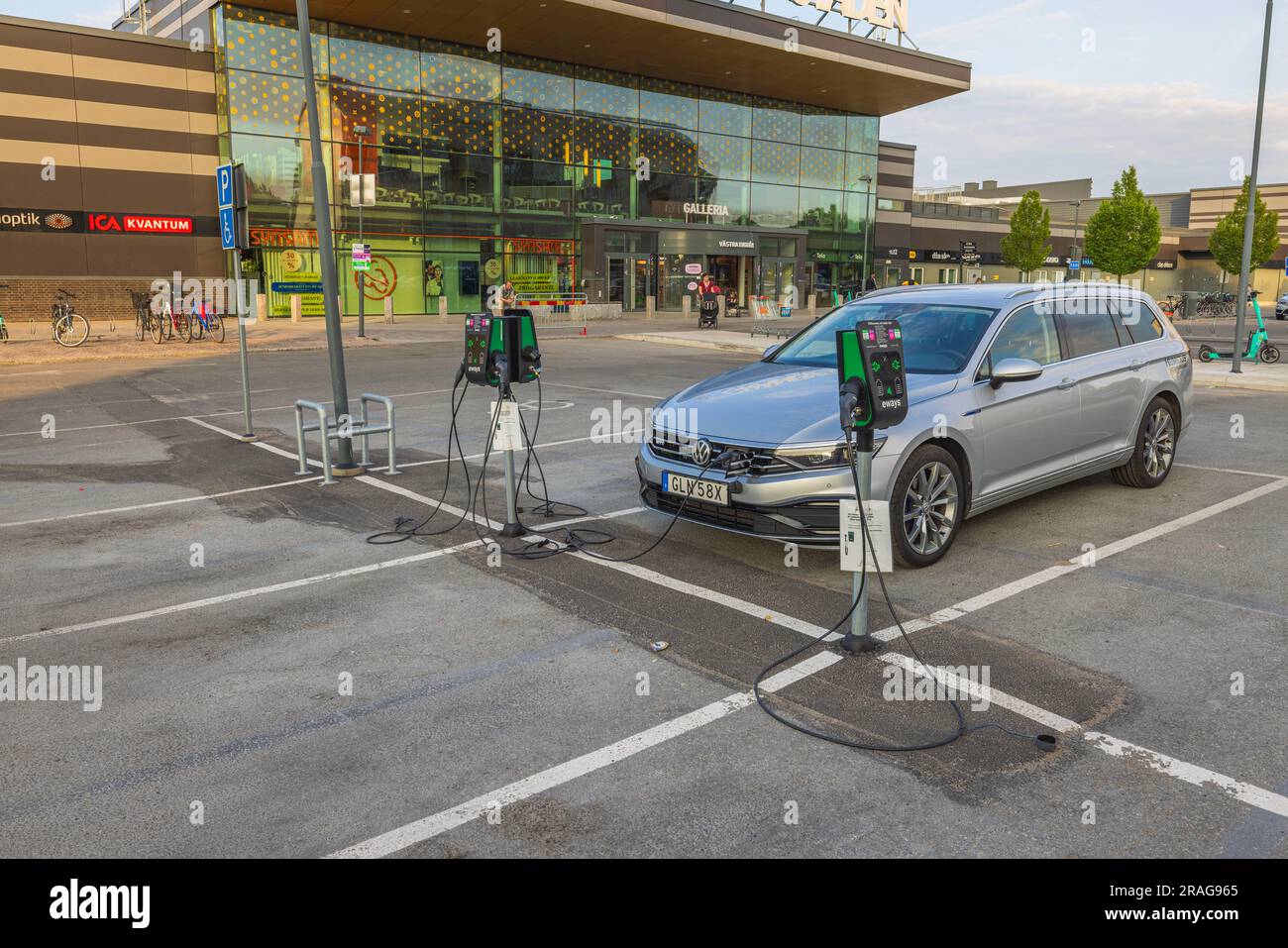 View of connected charging cable to Volkswagen car from electric