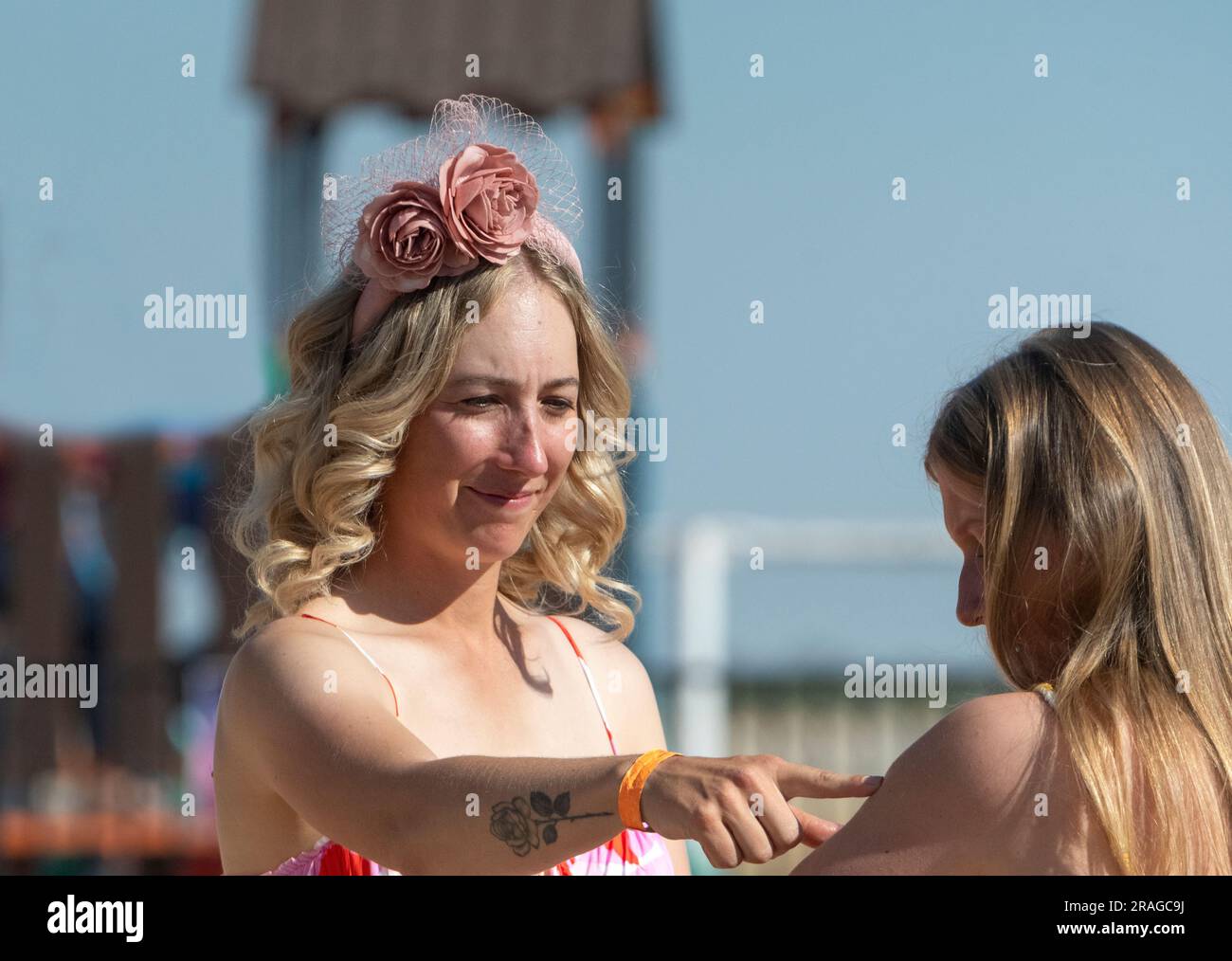 Elegant young woman on Ladies' Day at the Brunette Downs ABC Amateur Bush races, a traditional