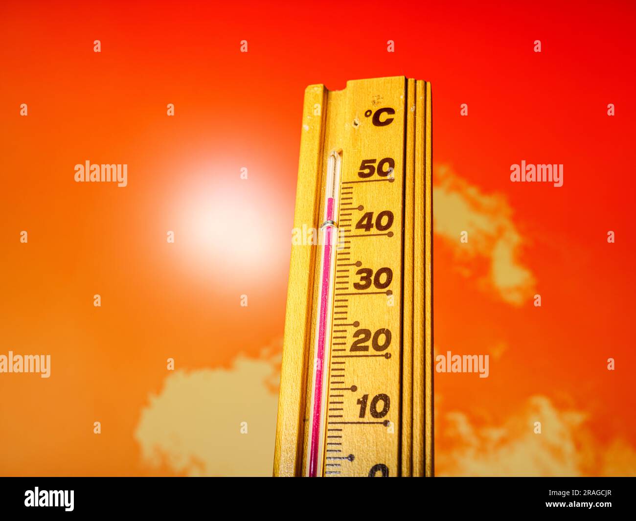 Hot summer day, the thermometer displays a high heatwave temperature of 40 degrees Celsius. Red alarm, warning, extreme weather, global climate change Stock Photo