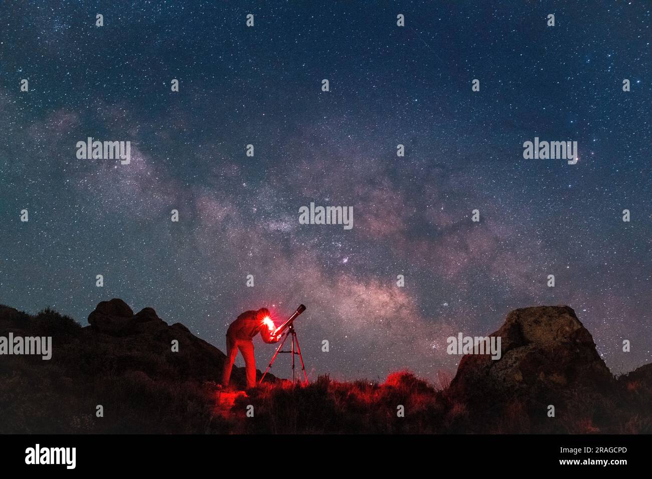 THE MILKY WAY CORE RISES ABOVE AN AMATEUR ASTRONOMER IN A DARK SKY AREA WEST OF GUNNISON, COLORADO. Stock Photo