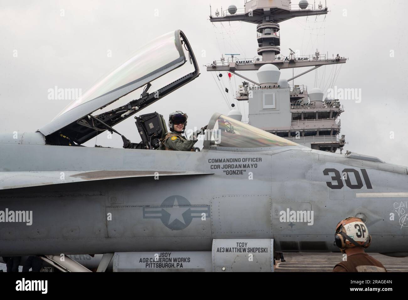 Lt. Thomas Kenner, from Sumter, South Carolina, assigned to the ÒTomcattersÓ of Strike Fighter Squadron (VFA) 31, prepares for flight operations on the flight deck of the worldÕs largest aircraft carrier USS Gerald R. Ford (CVN 78), July 1, 2023. Gerald R. Ford is the U.S. NavyÕs newest and most advanced aircraft carrier, representing a generational leap in the U.S. NavyÕs capacity to project power on a global scale. The Gerald R. Ford Carrier Strike Group is on a scheduled deployment in the U.S. Naval Forces Europe area of operations, employed by U.S. Sixth Fleet to defend U.S., allied, and p Stock Photo