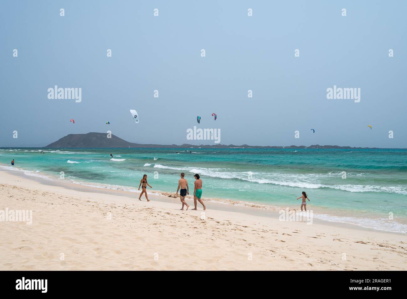 Tourists enjoy a hot summer weather at the crystal clear turquoise ...