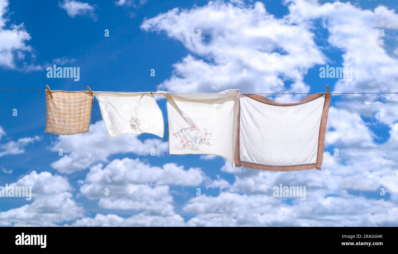 Fresh hung laundry against a blue sky and clouds. Stock Photo