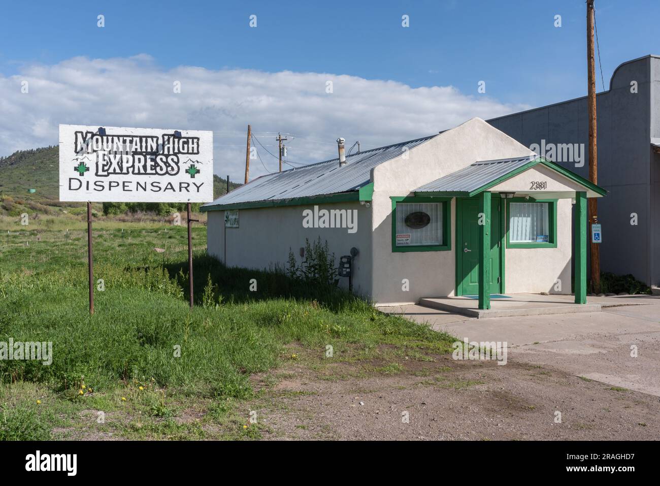 Exterior of Mountain High Express Dispensary, a small cannabis store in