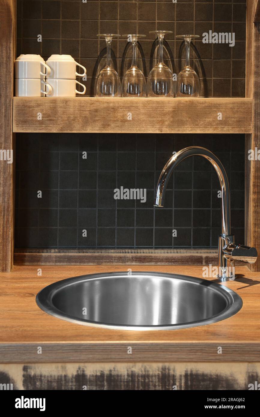 Stylish metal sink in hotel kitchen. Interior design Stock Photo - Alamy