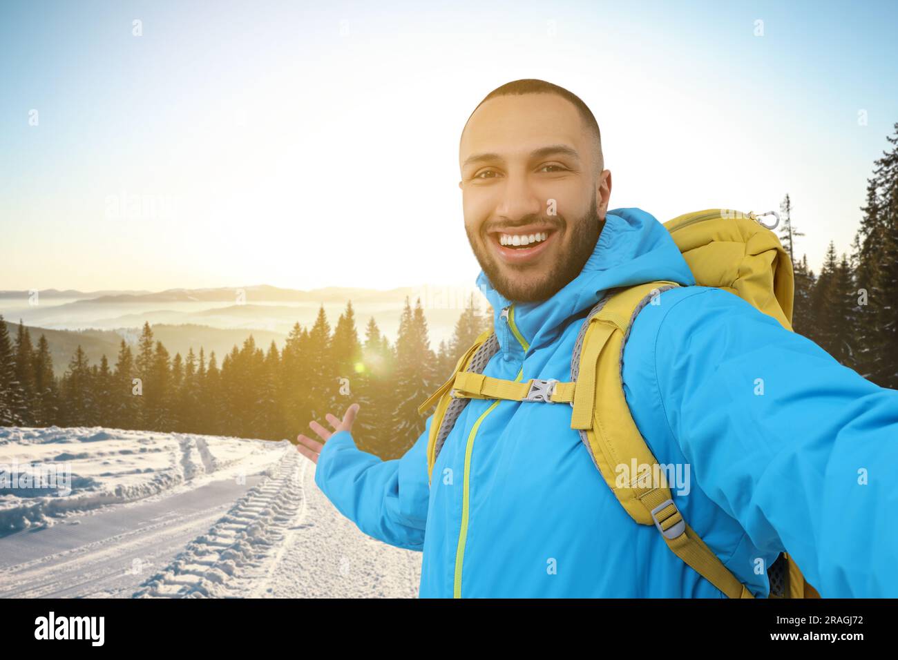 Man taking picture with mobile phone in mountains hi-res stock ...